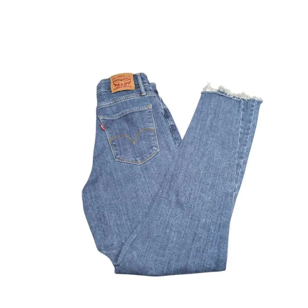Levi's 501 medium wash jeans featuring a raw, frayed hem Women's 27 ***Spot on L